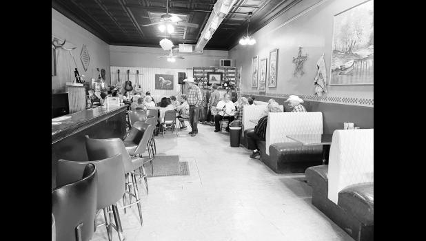Booths started to fill with people in the former Dakota Bar for the welcome home party for Edna Knutson. Michaela Lavender, Pioneer Review