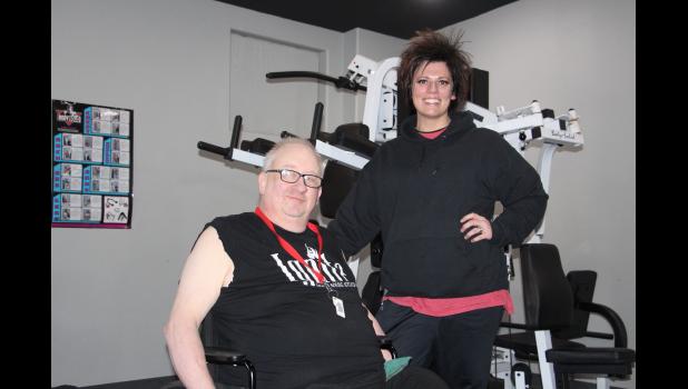 Duane takes a moment from his workout for a picture with a great friend since 2017, Tricia Burns, owner of Ignite Studios in Philip.