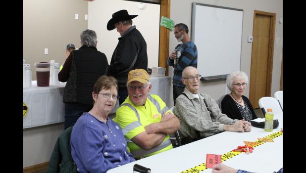 Rick and Rhonda Coyle sit at the guest table along with former Mayor Mike West and others at the Open House honoring Coyle for 45 years of service to the community.
