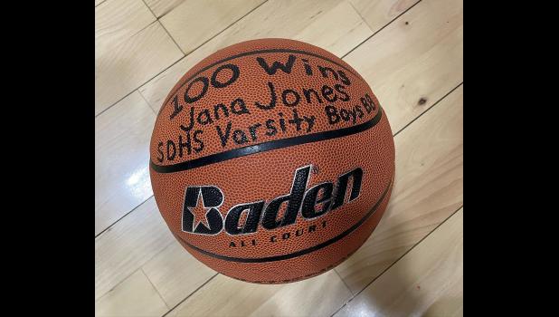 The ball the boys team presented to Coach Jones for her 100th game win.