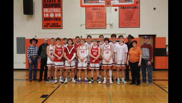 The Philip Scotties basketball team wore old warmup shirts and jerseys for Coach Jones and her 100th win. Shown back row (L to R): Morris Jones, former Midland Viking basketball player, Brad Hand, former Midland Viking basketball player who played under Coach Jones and Asst. Boys basketball coach, Evan Kroetch, Kade Fitzgerald, Race O’Connor, Sam Hand, Bryce Westby, Tyan Schofield, Jared Schofield, former Midland Viking basketball player who played under Coach Jones, and Jon Jones, former Midland Viking basketball player who played under Coach Jones. Front row (L to R): Wakely Burns, Layton Terkildsen, Jesse Fillingim, Brit Heltzel, Lane Kuchenbecker, Jess Jones, and Head Coach Jana Jones.