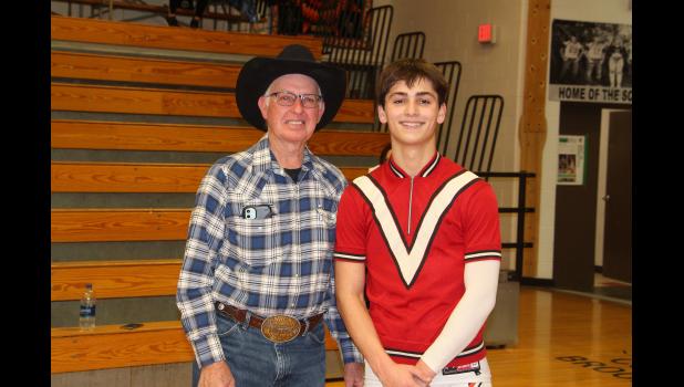 Layton Terkildsen wearing an old warm up shirt that Morris Jones wore when he played basketball for the Midland Vikings.