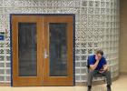 Garretson school district Business Manager Jacob Schweitzer sits outside the school library during an executive session of the school board Feb. 23. Photo: Stu Whitney, South Dakota News Watch